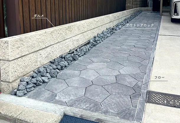 フローとダルメの石調の質感と照明が織りなす夜もおしゃれな外構デザイン